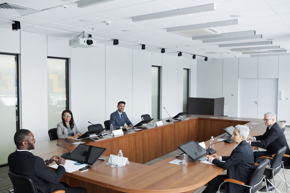 Professionals planning a business meeting in an international conference setting