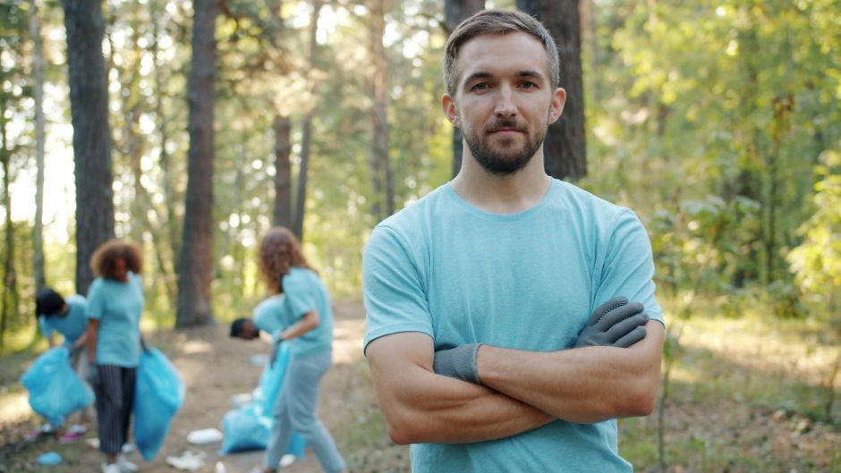 Volunteer group working together outdoors to protect natural areas