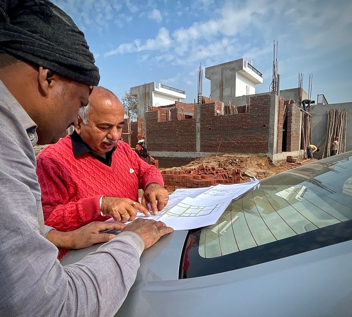 Architects discussing real estate development plans at a table.