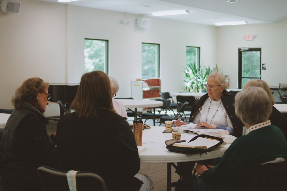 Community members in discussion about spiritual values