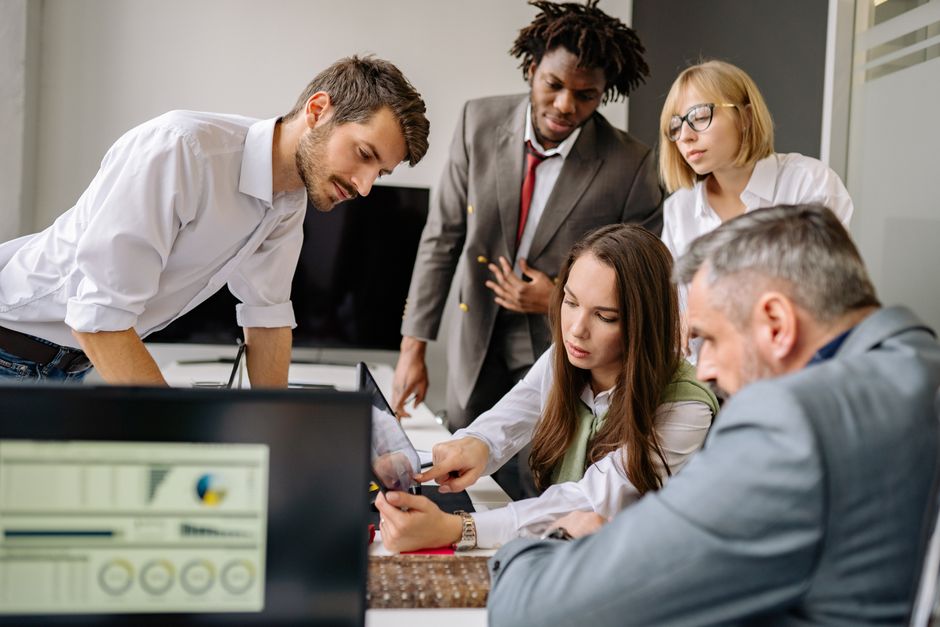 IT consultants discussing technology integration in a corporate environment