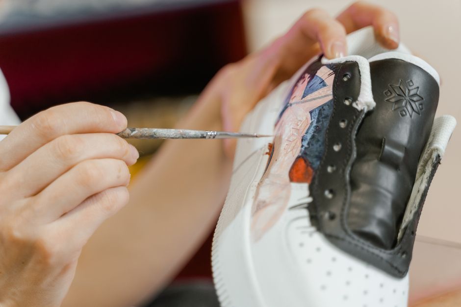 Consultant reviewing footwear design sketches