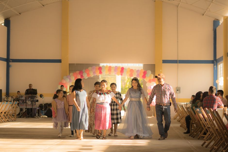 Families and guests celebrating in a decorated club hall