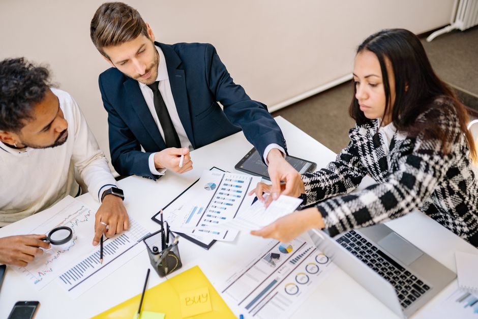 Team of professionals at a debt collection agency office