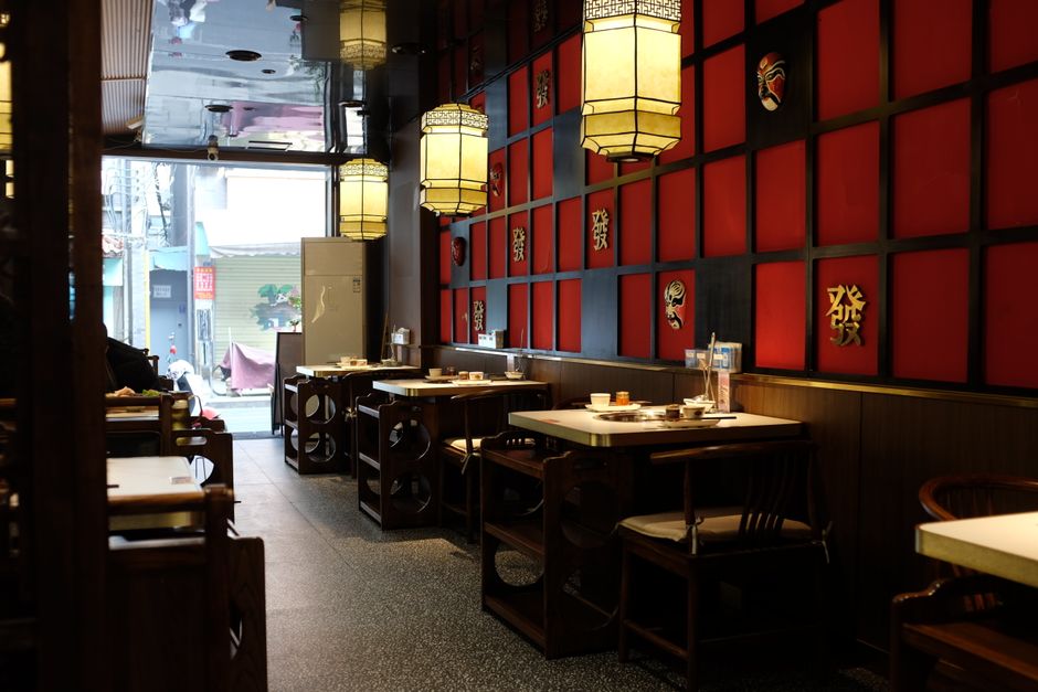 Interior view of a modern Chinese restaurant concept with dining tables