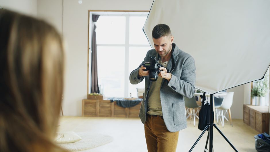 Professional photographer capturing interior real estate photos