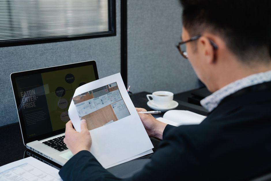 Consultant reviewing technology project documentation