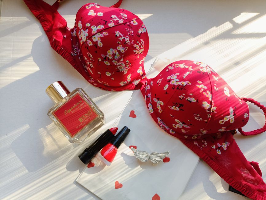 A selection of women’s lingerie and underwear arranged stylishly on a bed