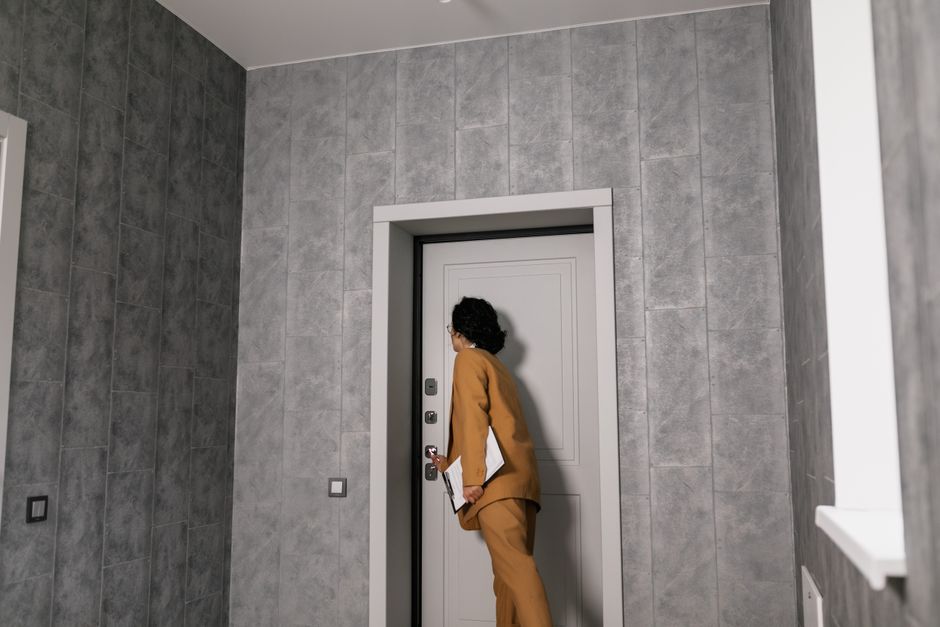 A property manager inspecting an apartment interior.
