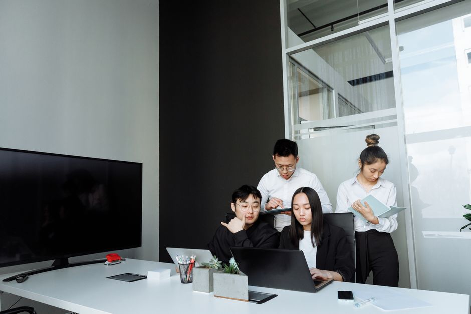 A tech team collaborating on mobile wallet fintech solutions