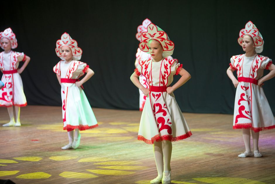 A group of actors performing in a community theatre production