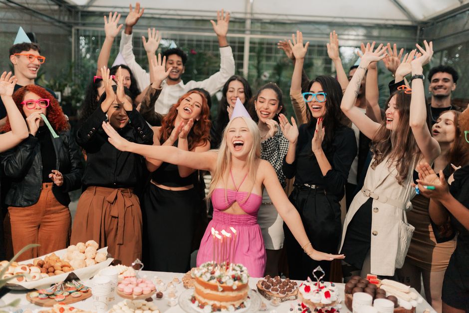 A group of friends participating in a baking class event