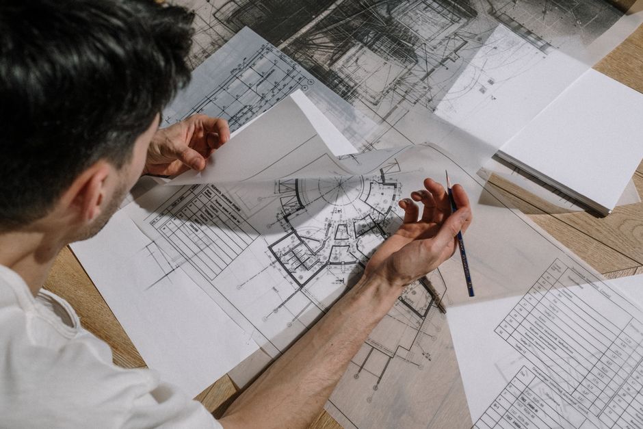 Architect reviewing housing project blueprints