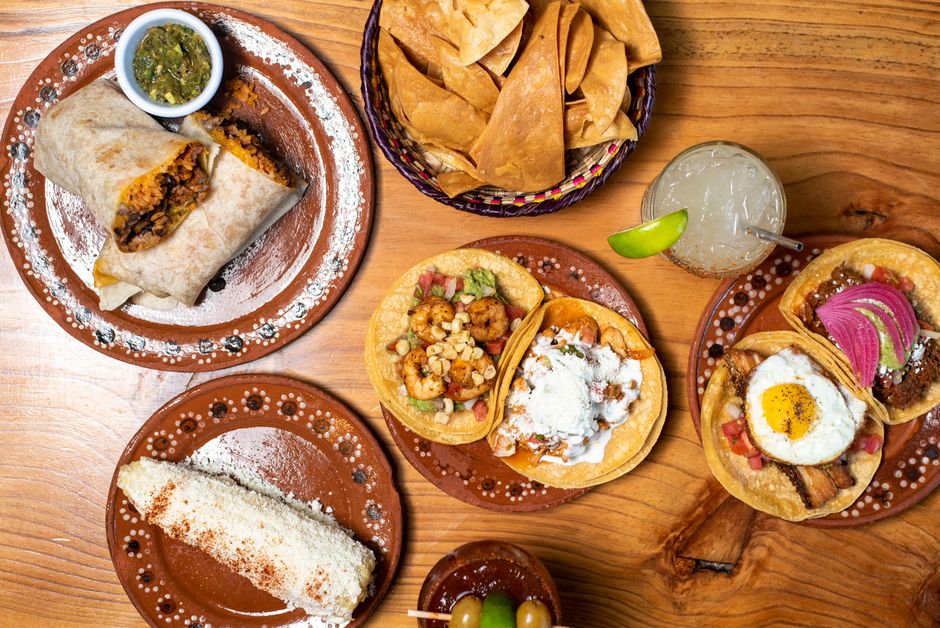 An inviting café interior with breakfast, burritos, and tacos.