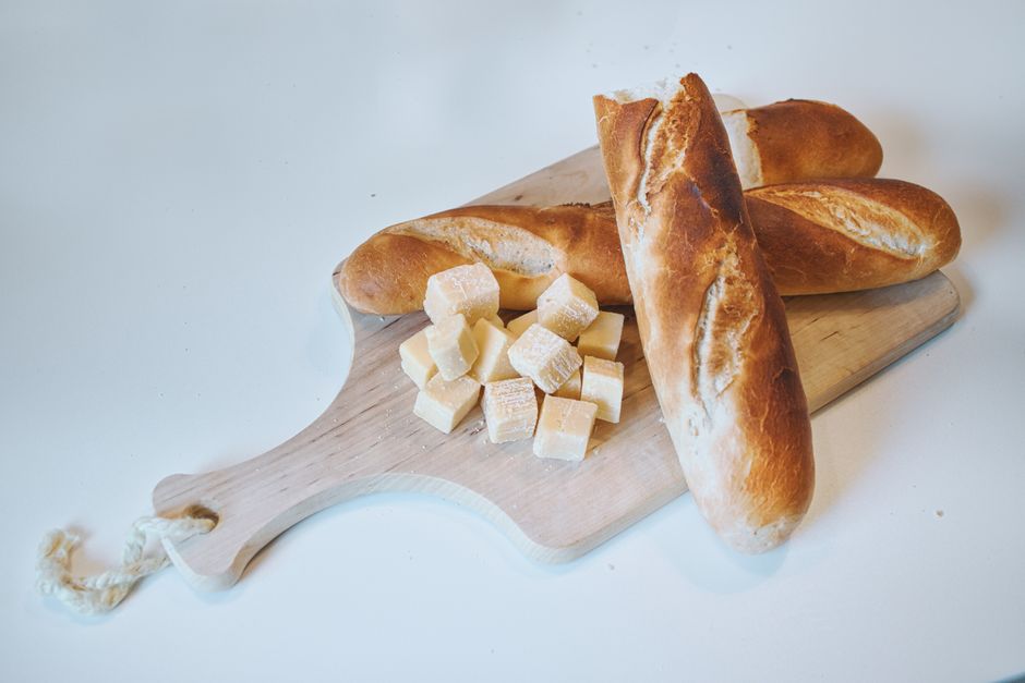 Oven-baked brie cheese with fresh baguette