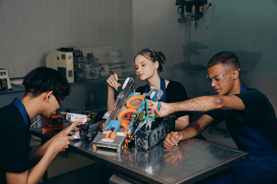 Engineering team assembling marine robotics equipment