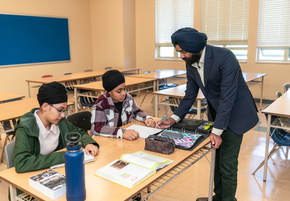 Tutor helping a middle school student with homework