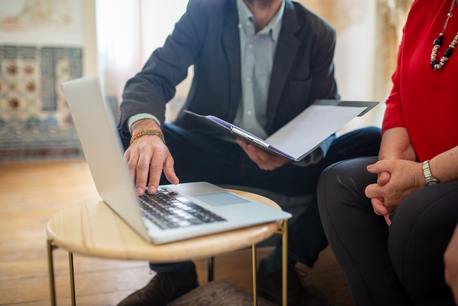 Social worker meeting with a client in a community office
