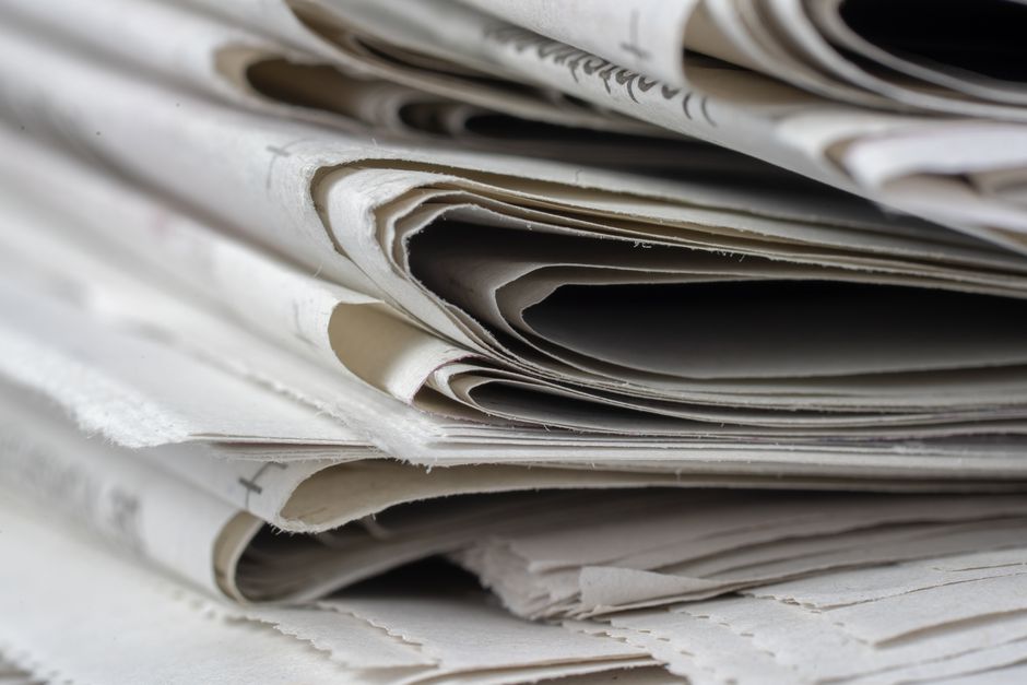 Editorial team collaborating on local news coverage