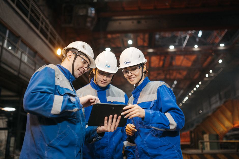 Industrial team working together in a warehouse or factory setting