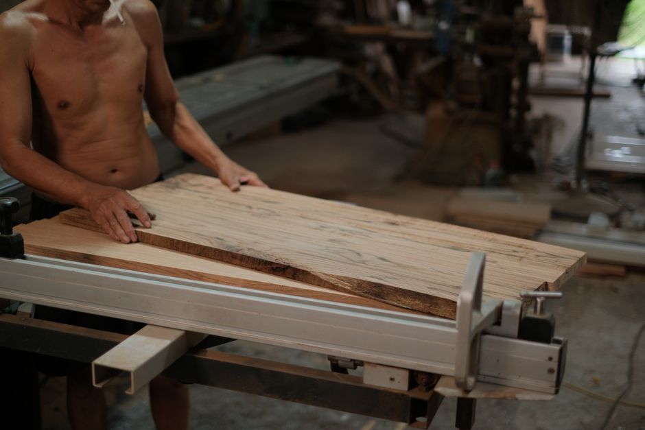 Carpenter working on a custom wood panel installation