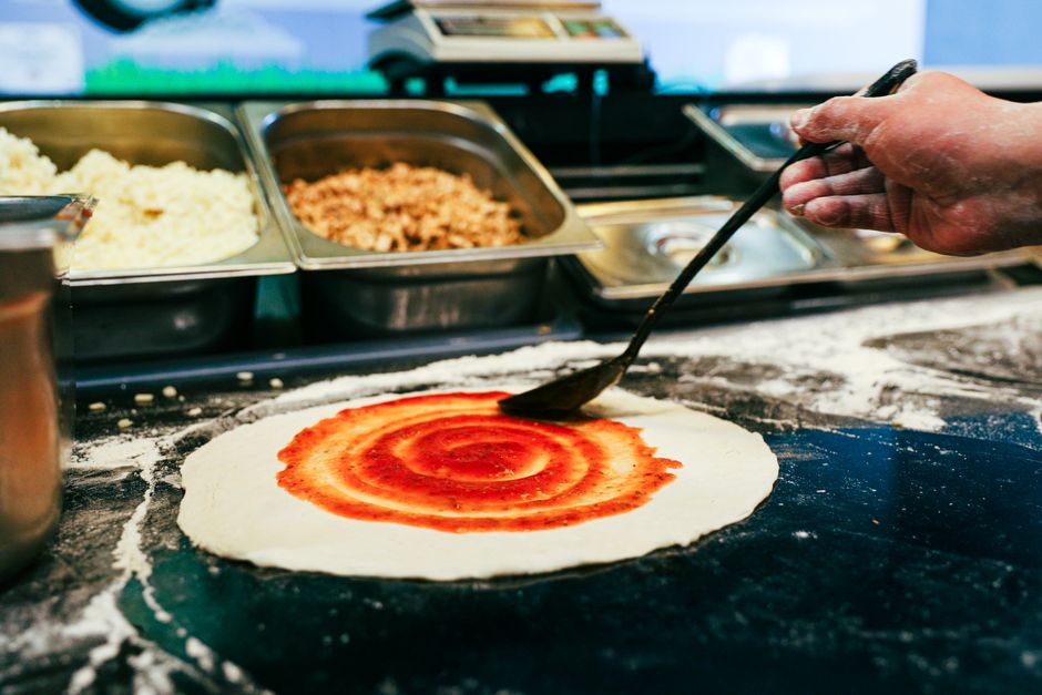 Chef preparing organic sauces in a kitchen