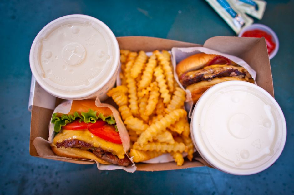 Takeout containers with American food ready for pickup