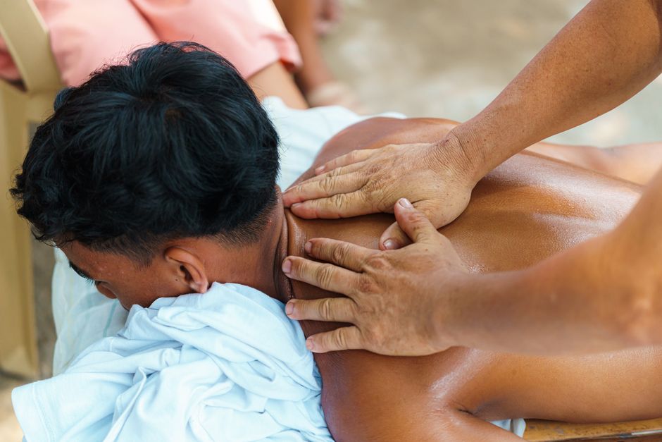 Massage therapist working with a client in a spa setting