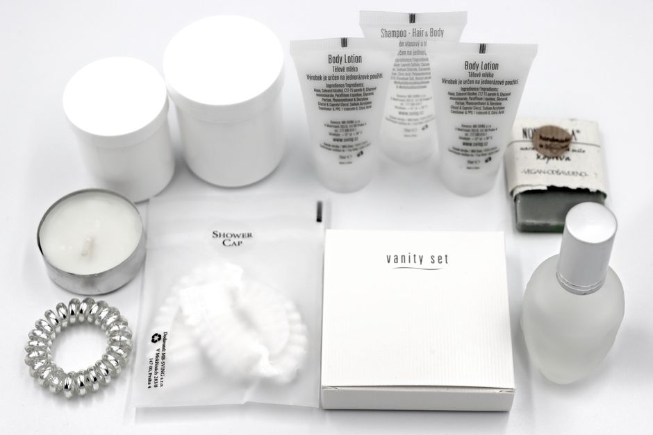 Display shelf with travel-sized perfumes and accessories.