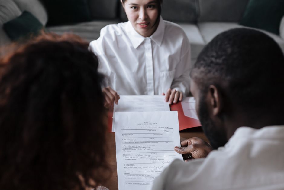 Case manager helping client fill in paperwork