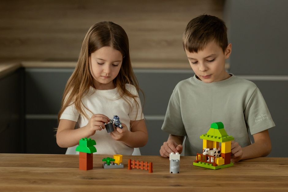 Children assembling a creative playset