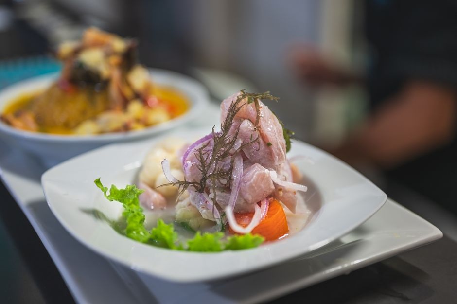 Chef preparing fresh ceviche with bright ingredients