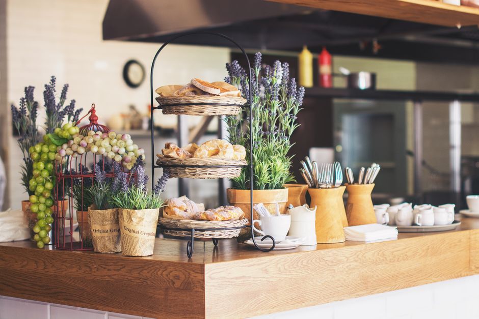 A cozy café interior with breakfast plates and coffee service