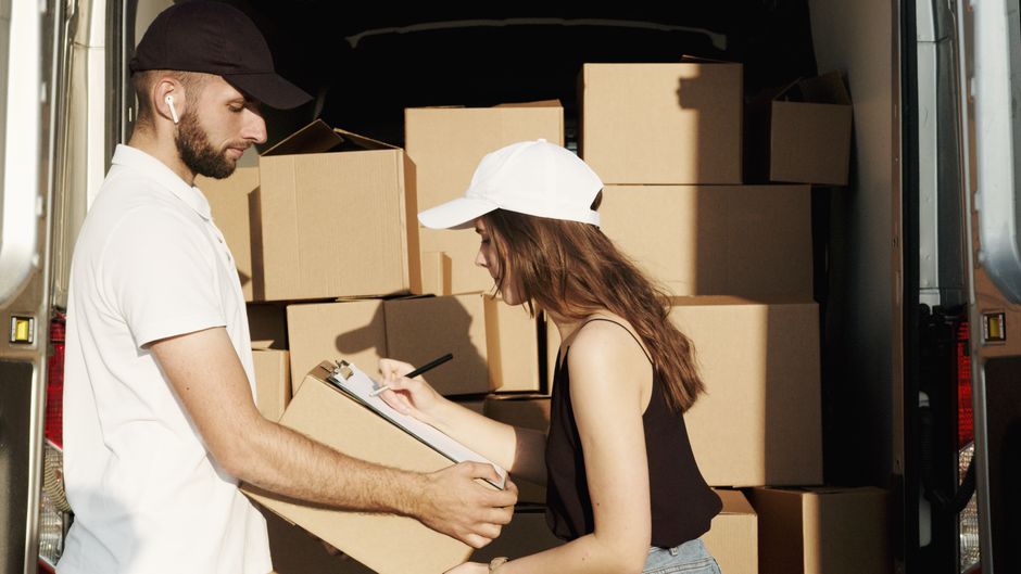 Logistics professionals planning delivery routes at a desk