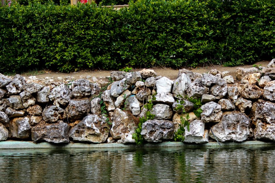 Retaining wall made of natural stone in a landscaped garden