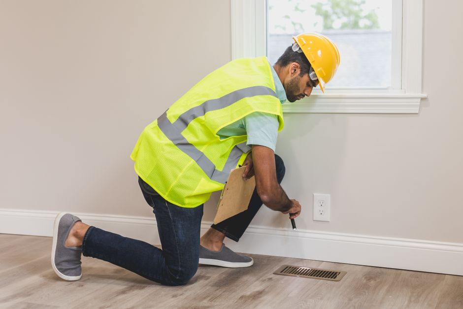 Contractor inspecting a house renovation site