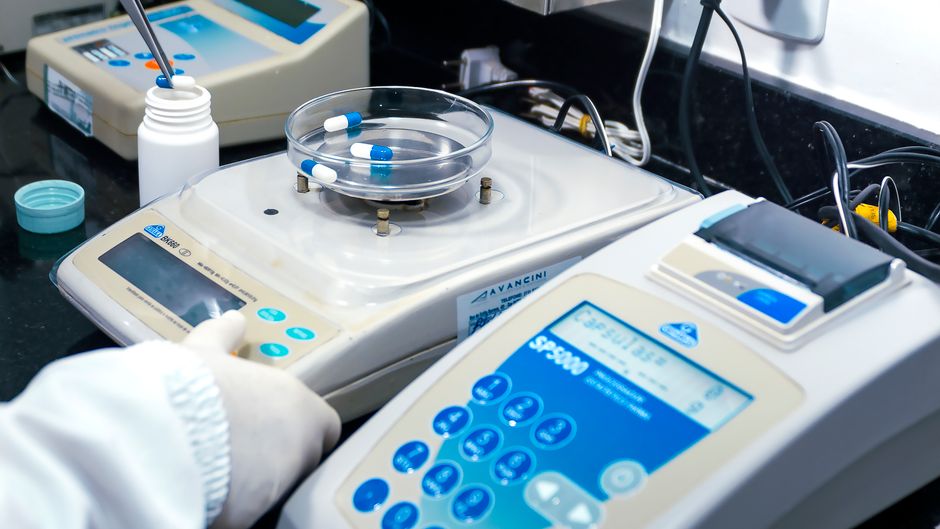 Scientific laboratory with supplement bottles and quality control equipment