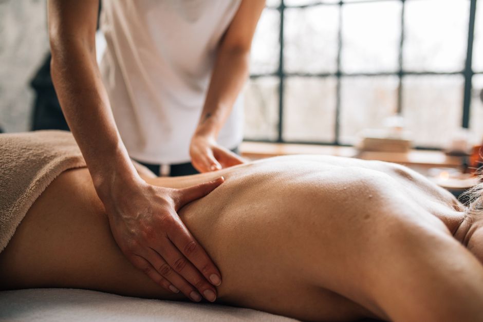 Deep tissue back massage in a tranquil spa room
