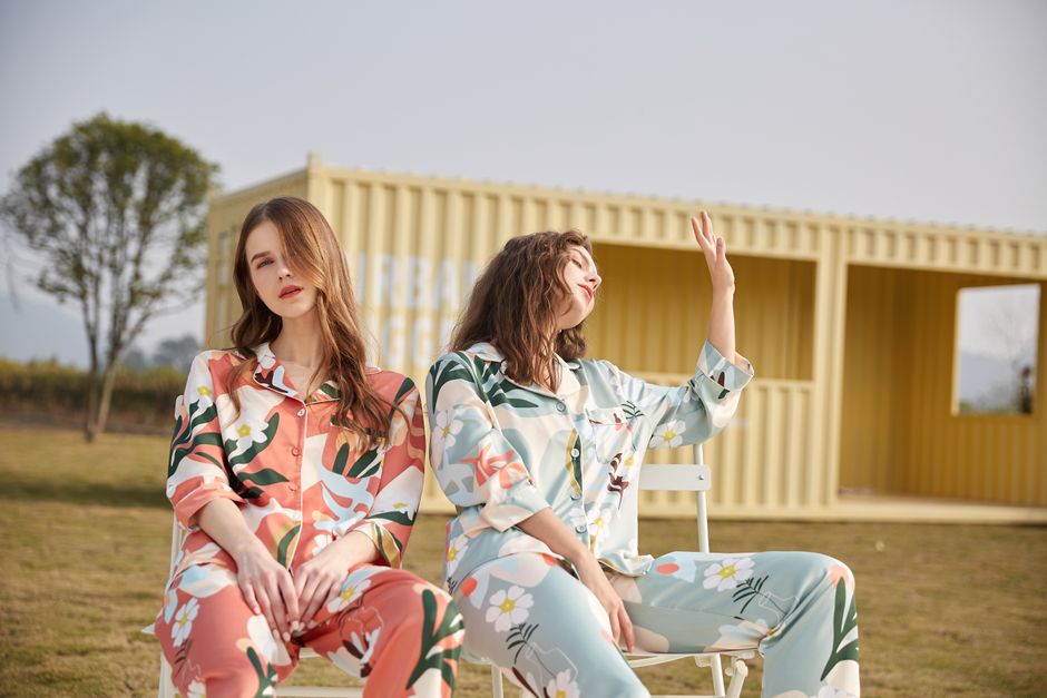 Trendy women's loungewear sets folded on a designer table