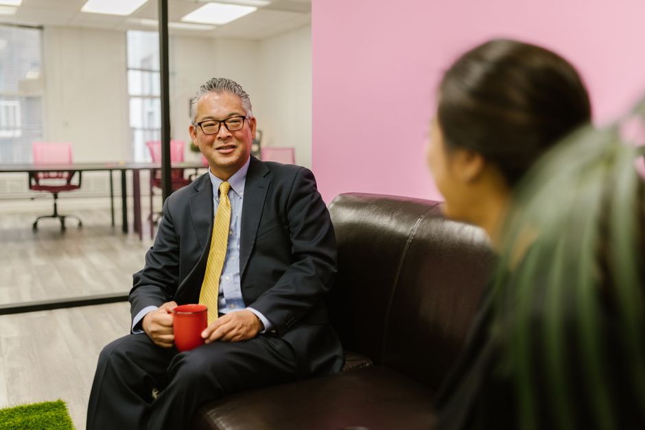 An executive coach meeting one-on-one with a business leader