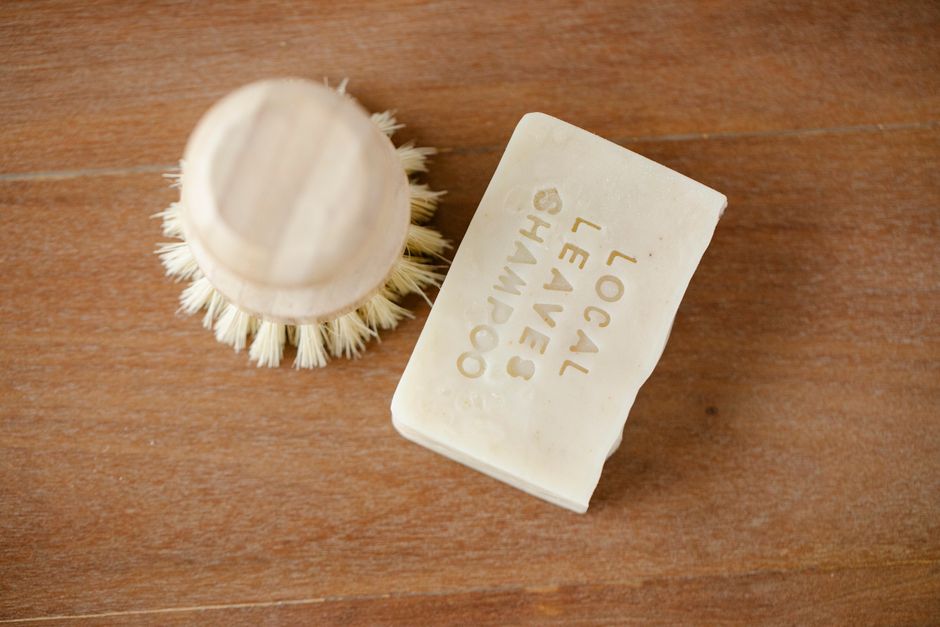Assorted solid shampoo bars displayed on a wooden surface