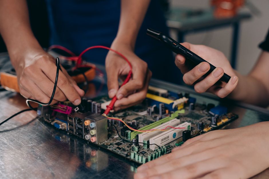 Engineer performing circuit edit on IC with FIB