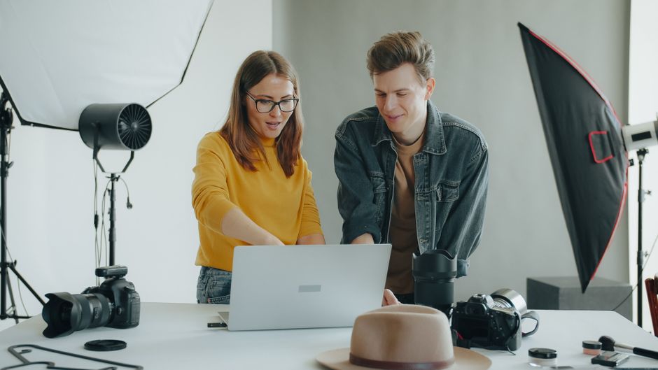 Creative media professionals collaborating in a modern workspace