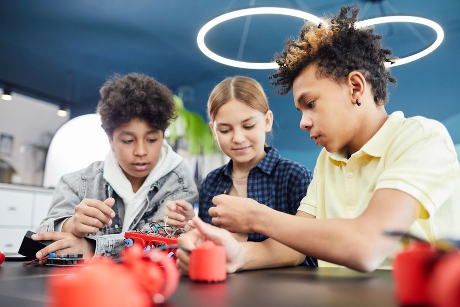 Children learning game design and coding at a workshop