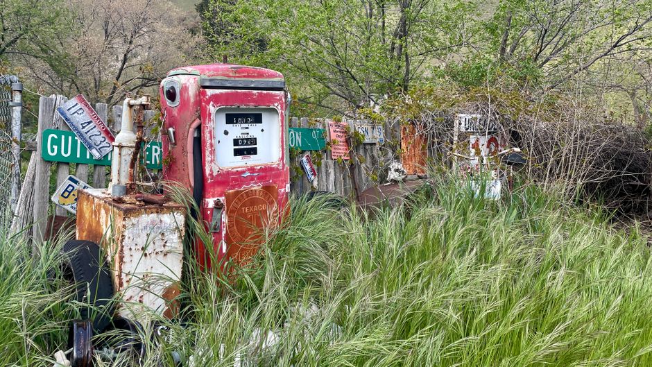 Visitors photographing a landmark gas station