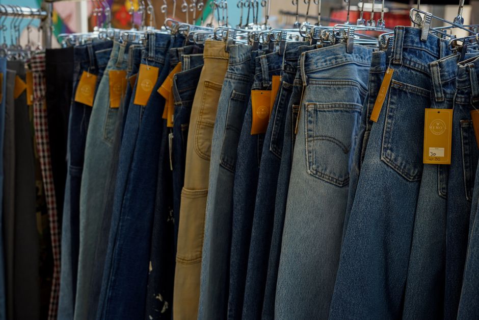J Brand denim essentials - men's and women's jeans on display