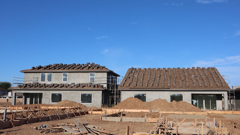 Exterior view of a custom-built home with high-end finishes