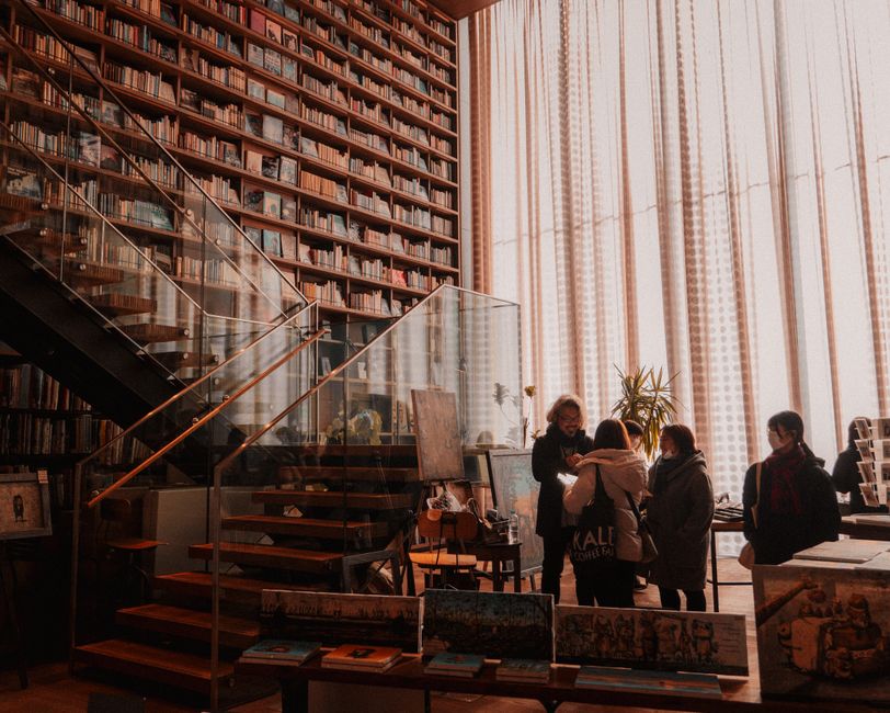 A welcoming bookstore interior with people browsing the aisles