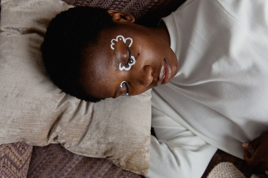 A relaxed adult practices self-help techniques for better sleep