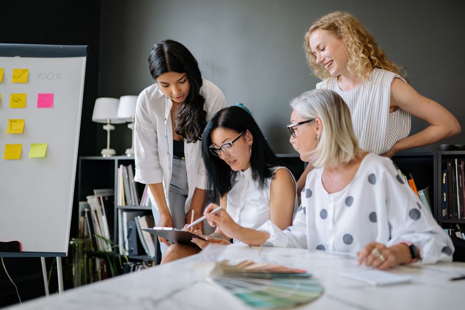 IT consultants collaborating on a project in a modern office